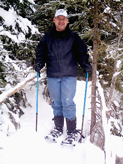 Calgary visitor David Mann enjoyed a wintry afternoon of snowshoeing around Lac des Roches on Dec. 20. Snow drifts up to two feet deep can be found everywhere around the lake that isn't exposed to the strong winds. — image credit: Sharron Woloshyn
