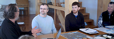 Barry Reid, left, explains residents' concerns to Jason Yates and Scott MacKinnon of the Kamloops Forests District office, while Gordon Marshall, right, looks on. The forestry agents met with 10 Lac des Roches area residents and later had a meeting with Fishing Highway 24 Tourism Association members about planned clear-cut logging. — image credit: Sharron Woloshyn
