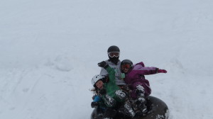 Grandchildren enjoy tubing on the slopes of Rock Island Ranch